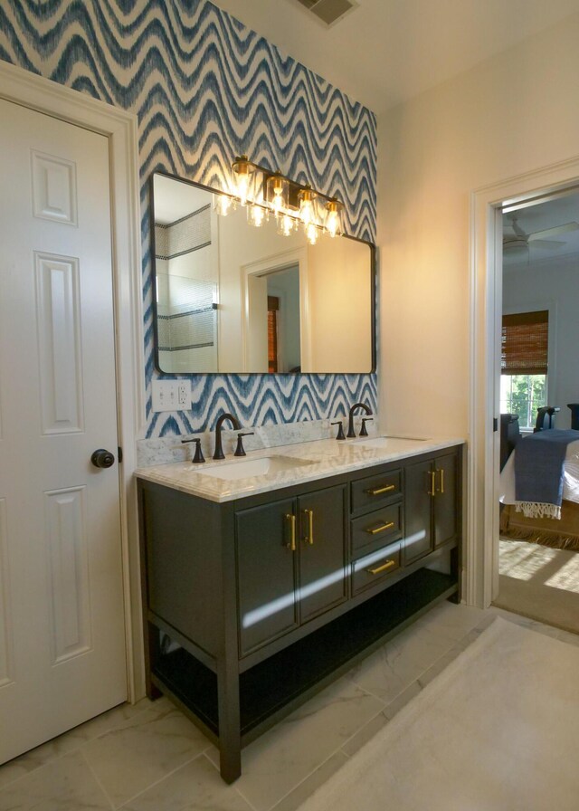 2128 Breezy Point Dr, Mount Pleasant, SC 29466 - bathroom with marble look tiles, double vanity, and decorative backsplash