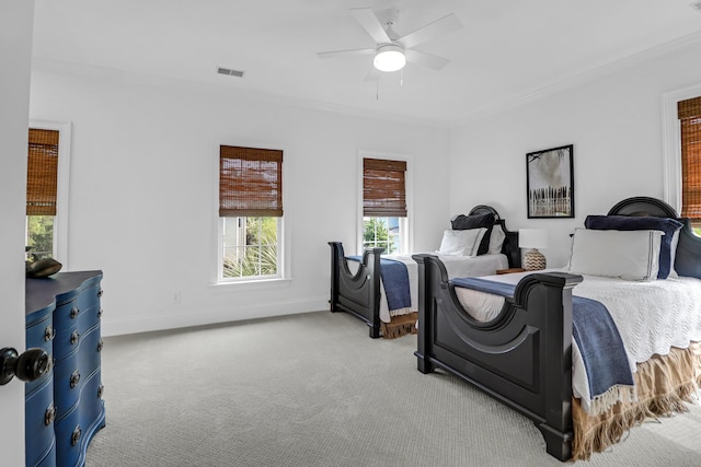 2128 Breezy Point Dr, Mount Pleasant, SC 29466 - bedroom featuring crown molding, carpet flooring, multiple windows, baseboards, and a ceiling fan