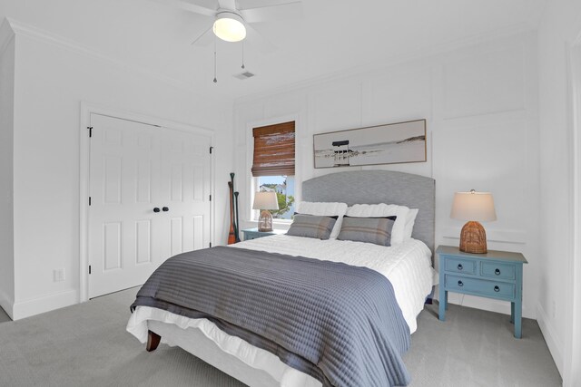 2128 Breezy Point Dr, Mount Pleasant, SC 29466 - bedroom featuring light carpet, baseboards, a closet, and crown molding