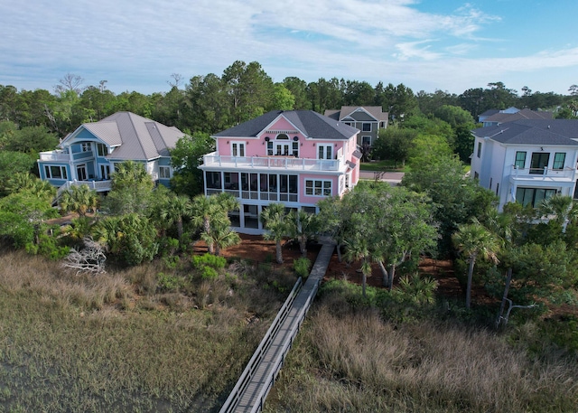 2128 Breezy Point Dr, Mount Pleasant, SC 29466 - rear view of house with a balcony and view of wooded area