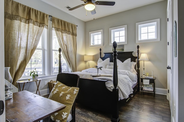 bedroom with ceiling fan and dark hardwood / wood-style flooring