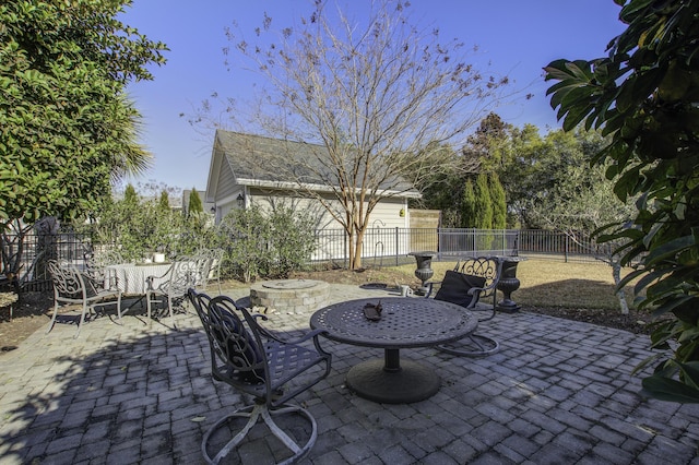 view of patio / terrace with an outdoor fire pit