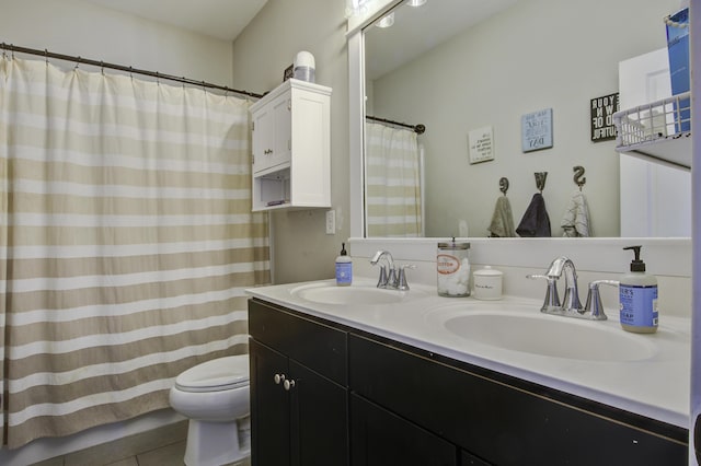 bathroom with vanity, toilet, and tile patterned flooring