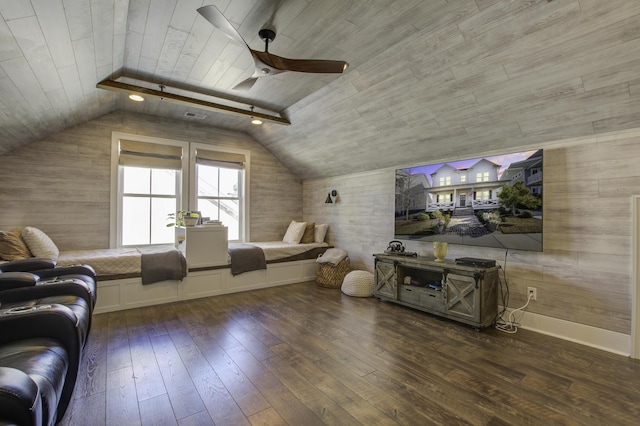 cinema room featuring dark hardwood / wood-style flooring, vaulted ceiling, wooden ceiling, and ceiling fan