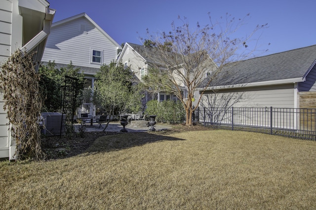 view of yard with a patio area and central air condition unit