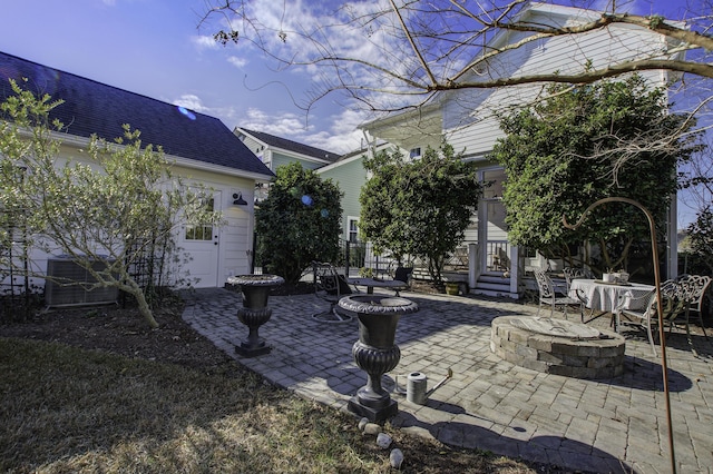 view of patio with an outdoor fire pit