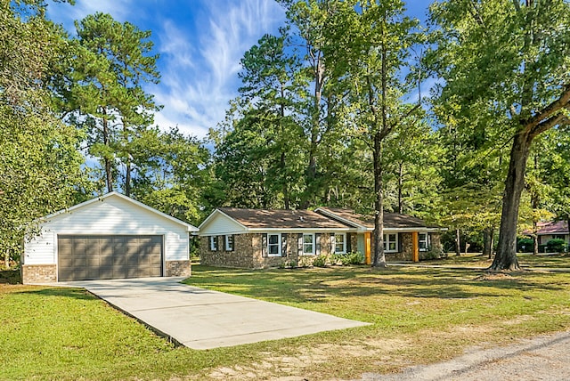 ranch-style house with a garage and a front lawn