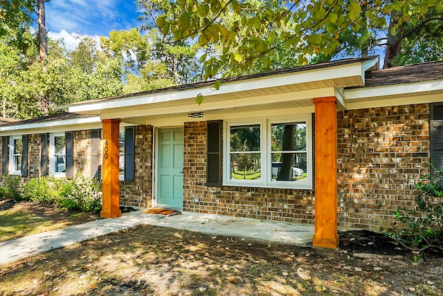 property entrance featuring covered porch