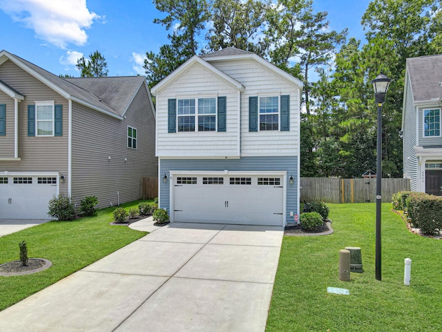 view of front of property featuring a front yard and a garage