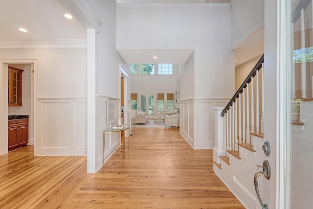 2701 Fountainhead Way, Mount Pleasant, SC 29466 - foyer entrance with a decorative wall, stairs, light wood-type flooring, wainscoting, and recessed lighting