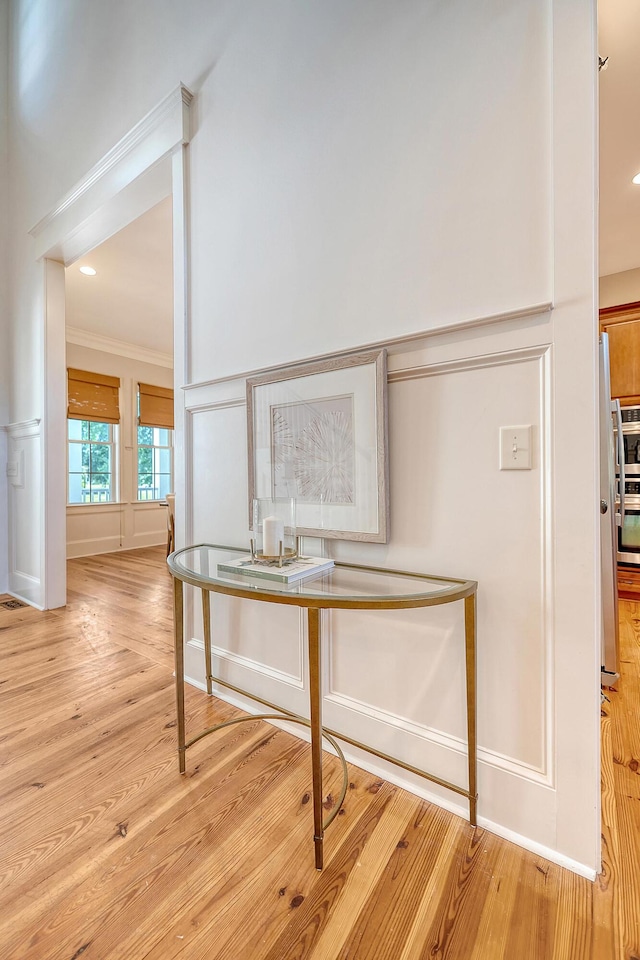 2701 Fountainhead Way, Mount Pleasant, SC 29466 - corridor featuring light wood-type flooring, ornamental molding, and a decorative wall