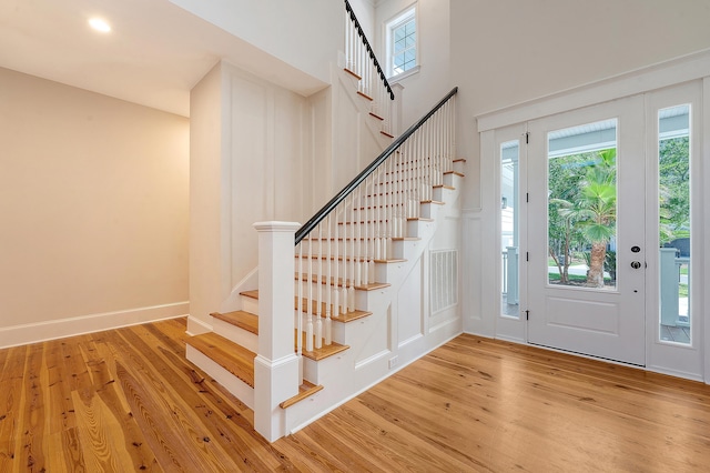 2701 Fountainhead Way, Mount Pleasant, SC 29466 - foyer with wood finished floors, stairs, plenty of natural light, and a towering ceiling