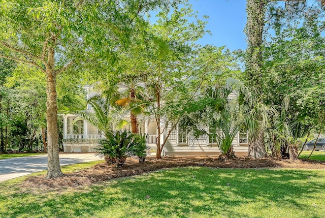 2701 Fountainhead Way, Mount Pleasant, SC 29466 - obstructed view of property featuring a front lawn and concrete driveway