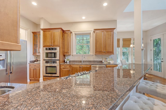 2701 Fountainhead Way, Mount Pleasant, SC 29466 - kitchen with a sink, appliances with stainless steel finishes, plenty of natural light, a breakfast bar, and recessed lighting