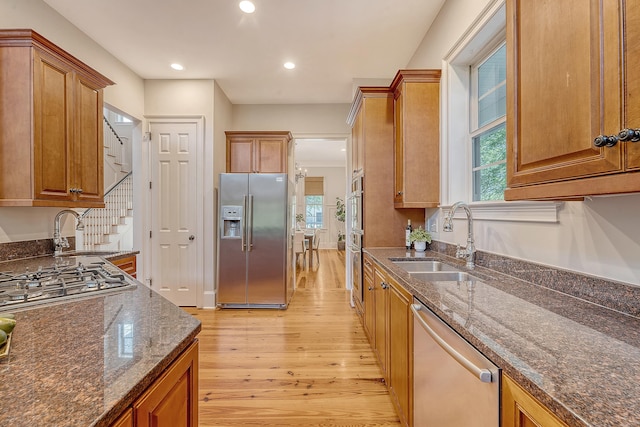 2701 Fountainhead Way, Mount Pleasant, SC 29466 - kitchen featuring stainless steel appliances, a sink, light wood-style flooring, dark stone counters, and recessed lighting