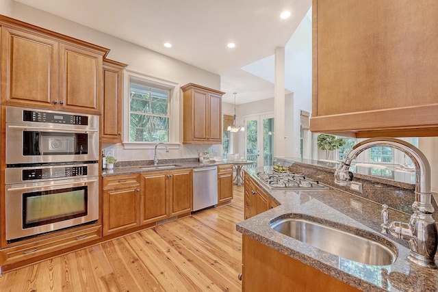 2701 Fountainhead Way, Mount Pleasant, SC 29466 - kitchen featuring stainless steel appliances, a sink, dark stone counters, light wood-style flooring, and recessed lighting