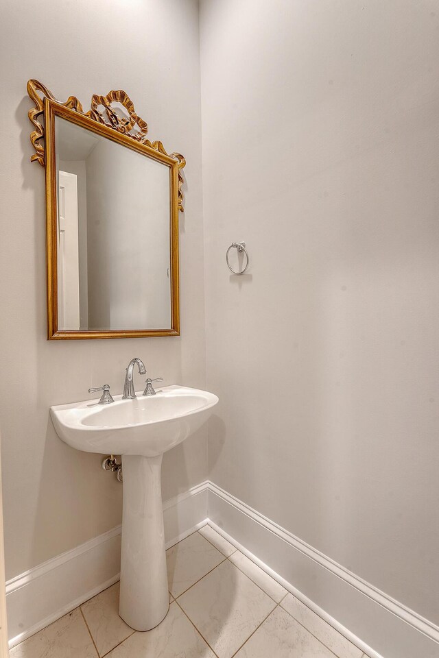 2701 Fountainhead Way, Mount Pleasant, SC 29466 - bathroom with baseboards and marble look tiles