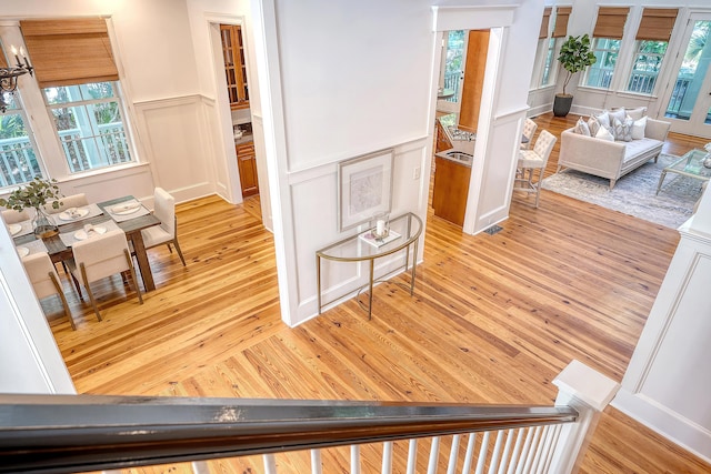 2701 Fountainhead Way, Mount Pleasant, SC 29466 - hall featuring wainscoting, a decorative wall, and light wood finished floors