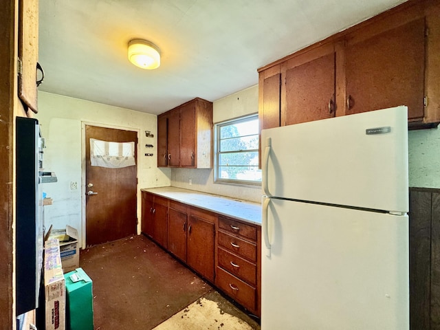524 Kell Pl, Charleston, SC 29412 - kitchen with freestanding refrigerator, light countertops, and brown cabinets