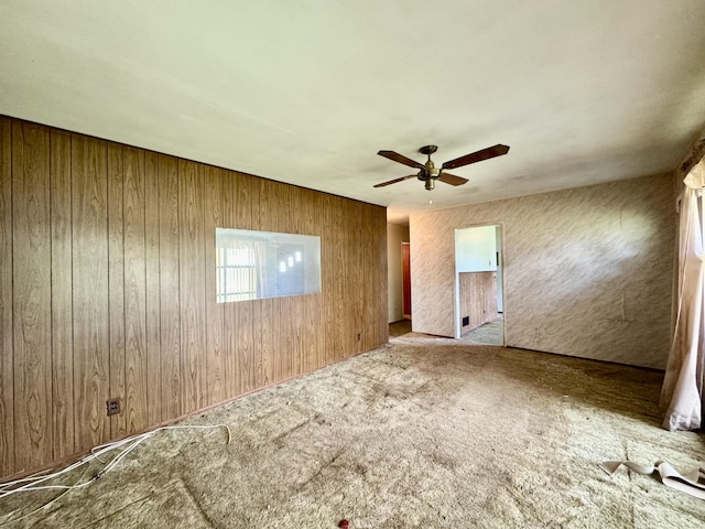 524 Kell Pl, Charleston, SC 29412 - unfurnished bedroom featuring wooden walls, carpet flooring, and a ceiling fan