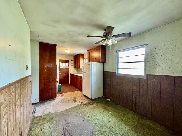 524 Kell Pl, Charleston, SC 29412 - kitchen with freestanding refrigerator, a wainscoted wall, wooden walls, and ceiling fan