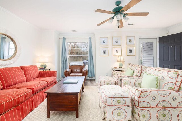 living room with visible vents and crown molding