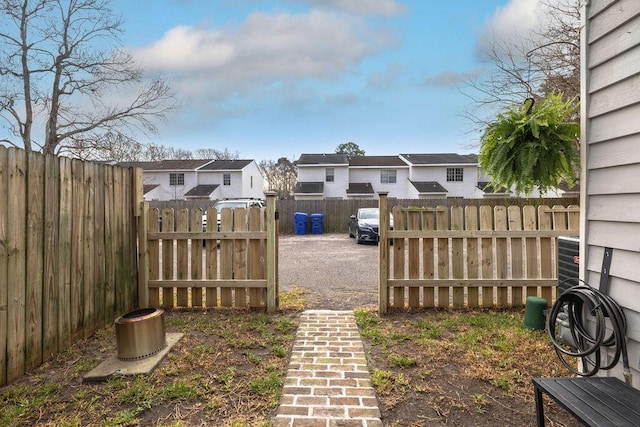 view of yard with a residential view and fence