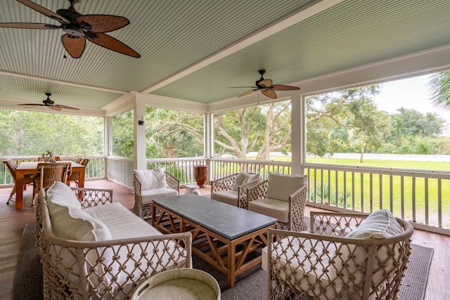 exterior space featuring ceiling fan and an outdoor living space