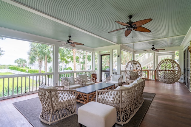 sunroom with ceiling fan and plenty of natural light