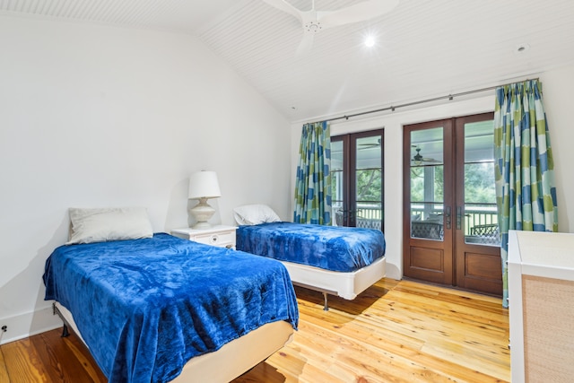 bedroom featuring light hardwood / wood-style floors, vaulted ceiling, ceiling fan, french doors, and access to outside