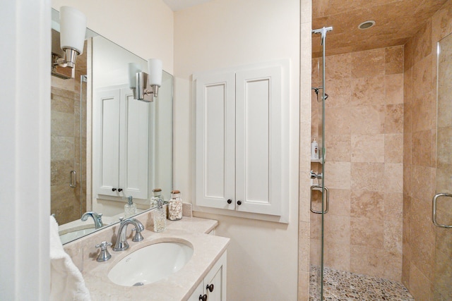 bathroom with vanity and an enclosed shower