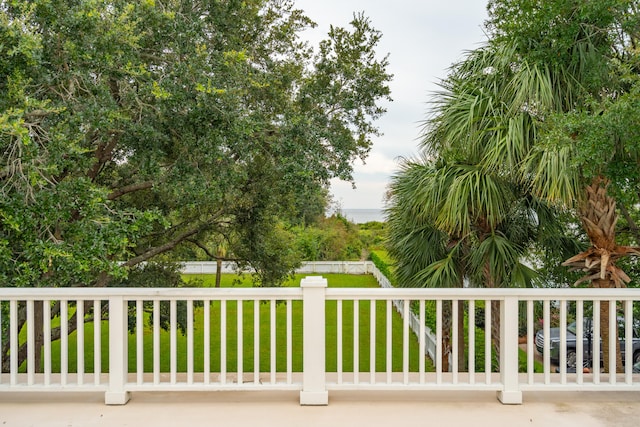 view of gate featuring a lawn