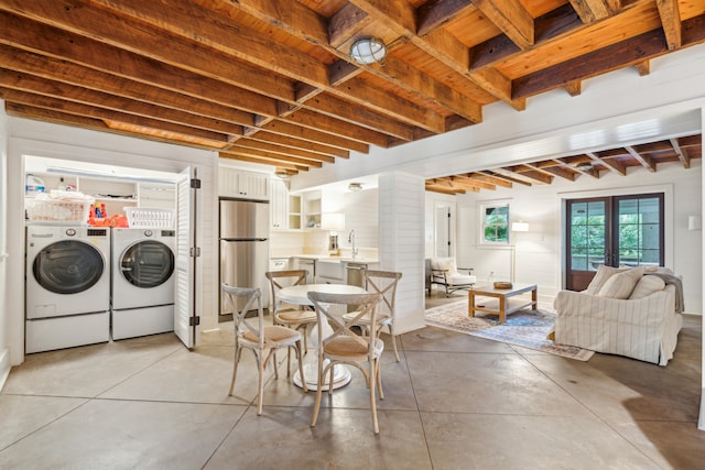 interior space with french doors and washing machine and dryer