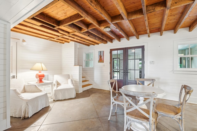 interior space with french doors, beamed ceiling, and wooden ceiling