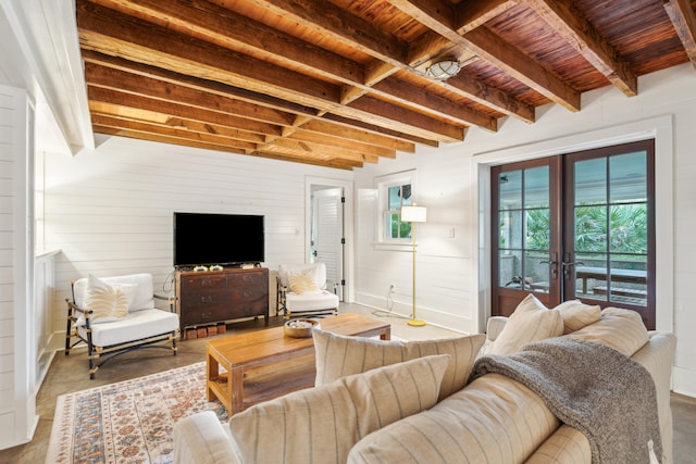 living room featuring french doors, wood ceiling, and beam ceiling