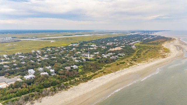 bird's eye view with a water view and a view of the beach