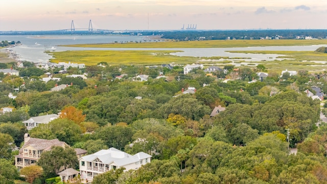 aerial view at dusk with a water view