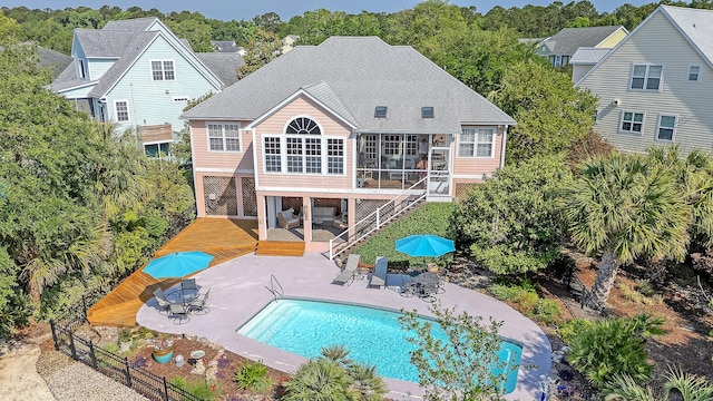 1308 Divot Ct, Mount Pleasant, SC 29466 - rear view of property with a sunroom, a patio, a deck, an outdoor pool, and roof with shingles