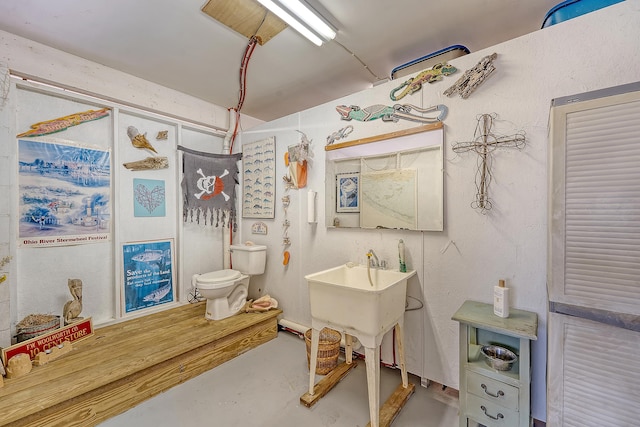1308 Divot Ct, Mount Pleasant, SC 29466 - bathroom with toilet, concrete flooring, and a sink