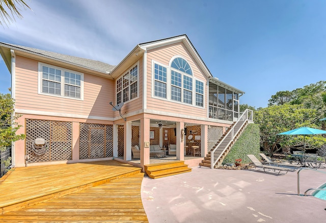 1308 Divot Ct, Mount Pleasant, SC 29466 - back of house featuring a sunroom, a patio area, a deck, stairs, and ceiling fan