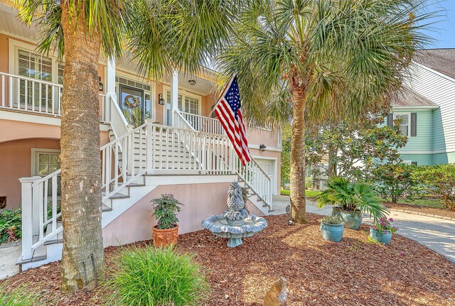 1308 Divot Ct, Mount Pleasant, SC 29466 - doorway to property featuring covered porch and stucco siding