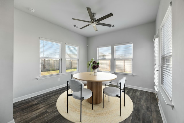 dining room featuring ceiling fan and dark wood-type flooring