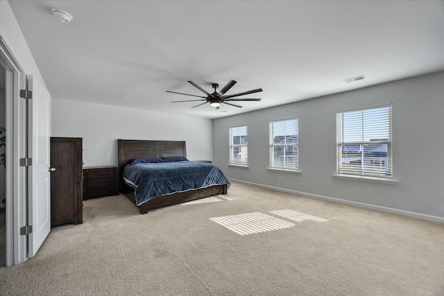 carpeted bedroom with ceiling fan