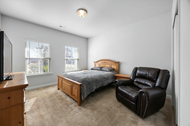 bedroom featuring light colored carpet