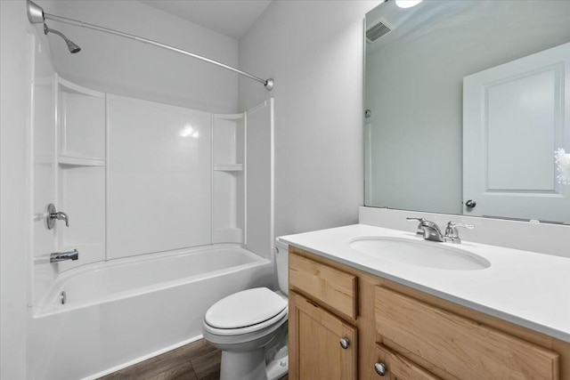 full bathroom featuring shower / bathing tub combination, vanity, toilet, and wood-type flooring