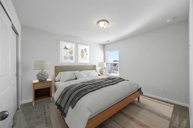 carpeted bedroom featuring a closet