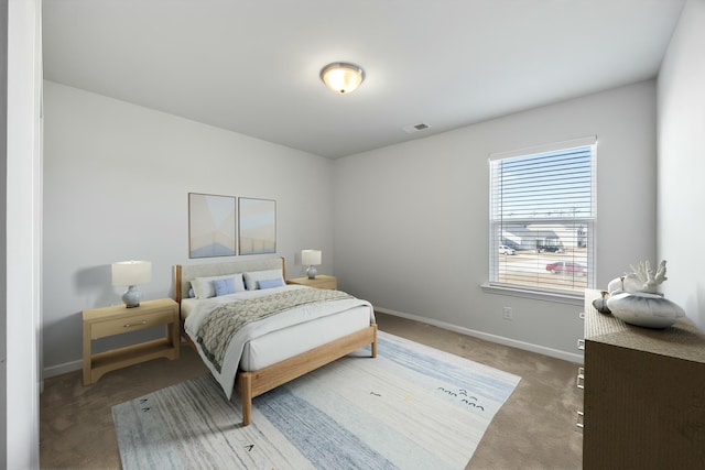 bedroom with light colored carpet