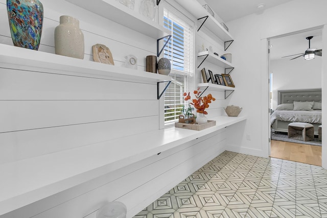 interior space with light hardwood / wood-style flooring and ceiling fan