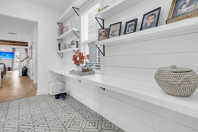 mudroom featuring light hardwood / wood-style flooring and a healthy amount of sunlight