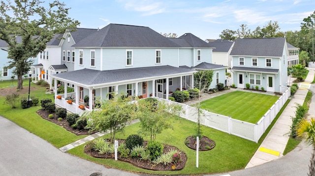 view of front of property featuring a front yard and a porch